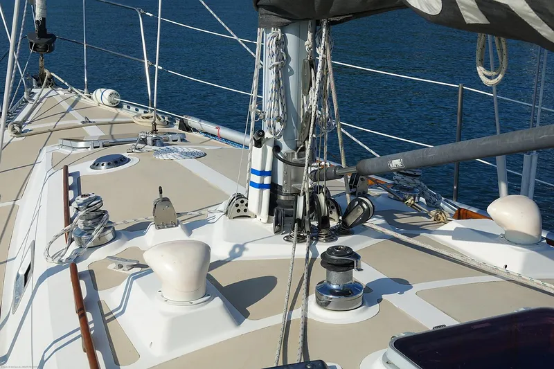 Slide: The Image of Sailboat deck of 1989 Nordic 40, featuring rigging and winches. - 13