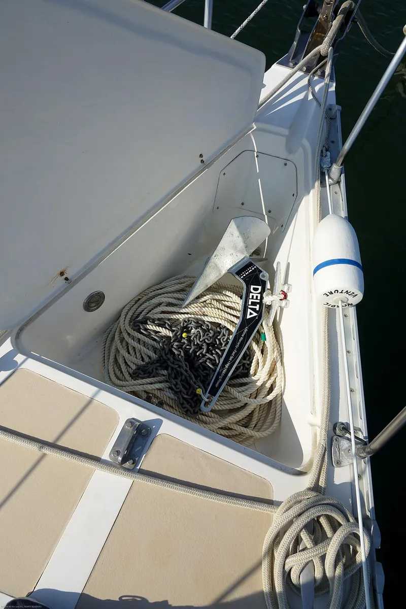 Slide: The Image of Nordic 40 sailboat deck with anchor and coiled rope, 1989 model. - 15
