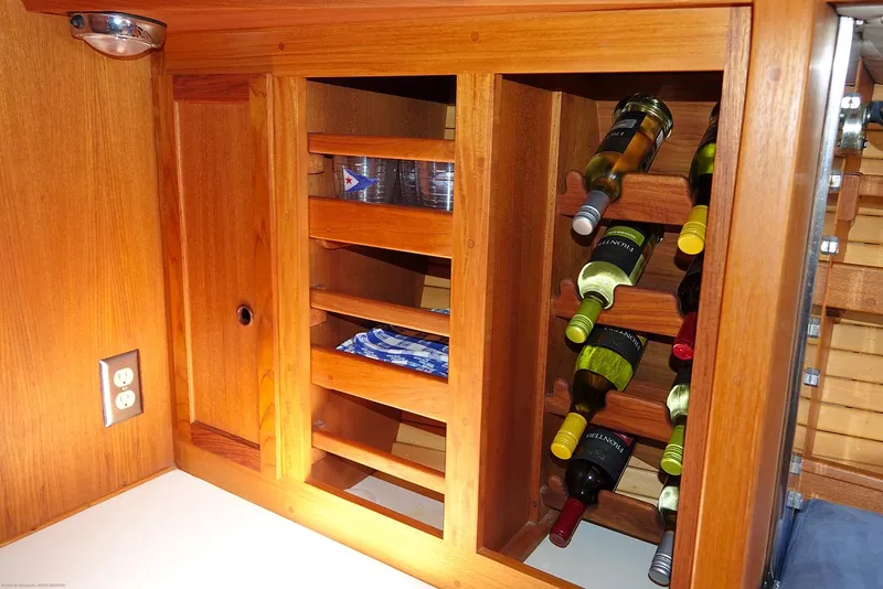 Slide: The Image of Wooden wine rack and storage in 1989 Nordic 40 boat interior. - 34