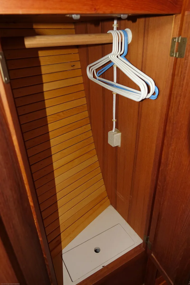 Slide: The Image of Wooden closet interior with hangers, Nordic 40 model, 1989. - 42