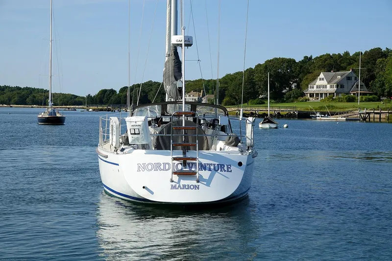 Slide: The Image of Sailboat "Nordic Venture" on calm water, Nordic 40 model, 1989, near shoreline. - 5