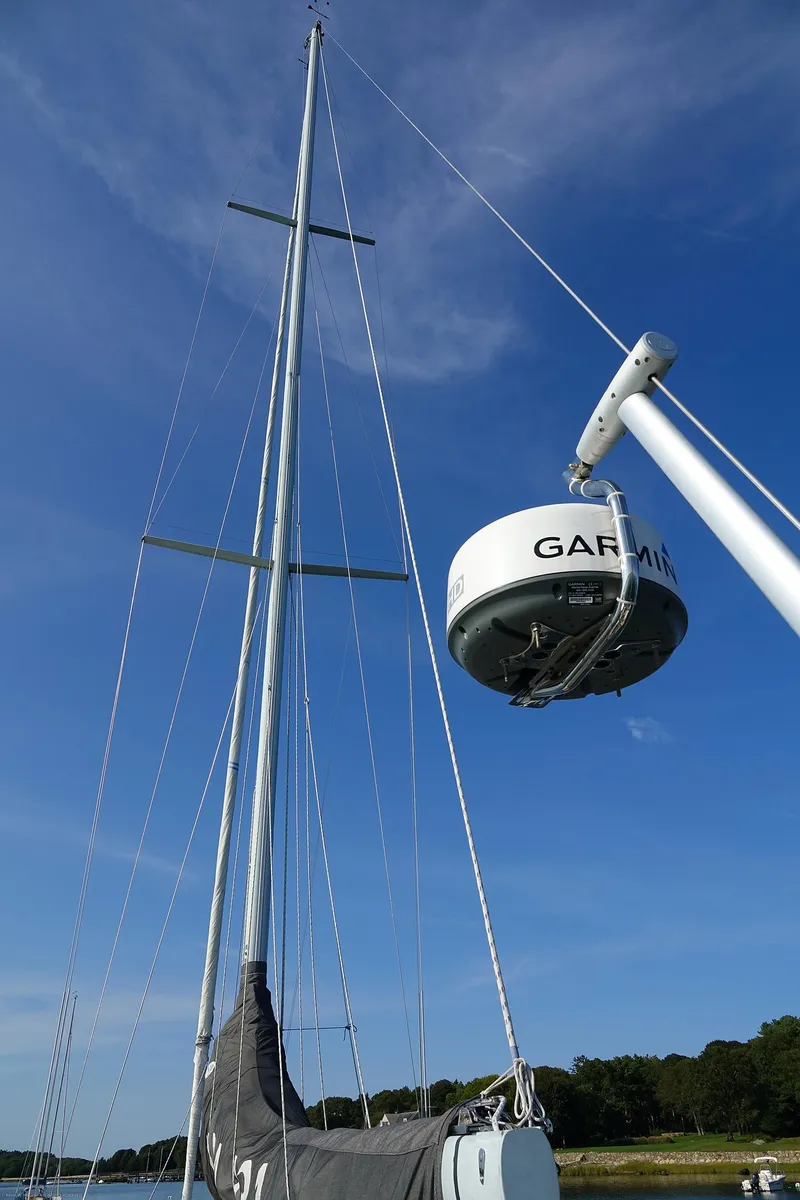 Slide: The Image of Sailboat mast with Garmin radar, Nordic 40, 1989 model, under clear blue sky. - 8