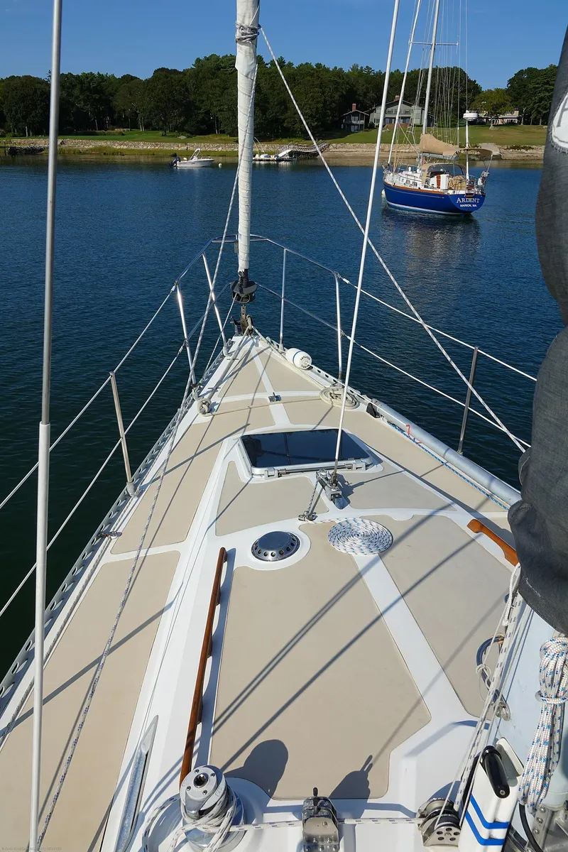 Slide: The Image of Sailboat deck view, Nordic 40 model, 1989, on calm water with another boat nearby. - 90