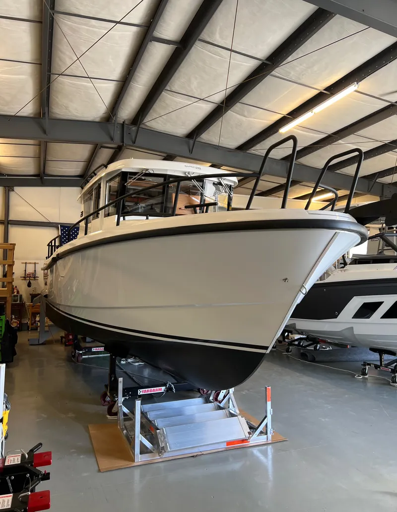 Slide: The Image of 2024 Sargo 28 boat in a storage facility. - 2