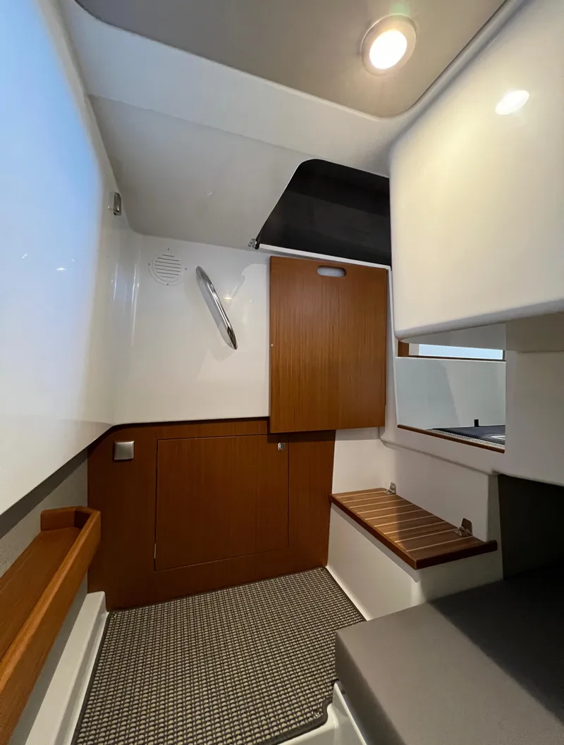 Slide: The Image of Interior cabin of 2024 Sargo 28 boat with wooden accents and modern design. - 25