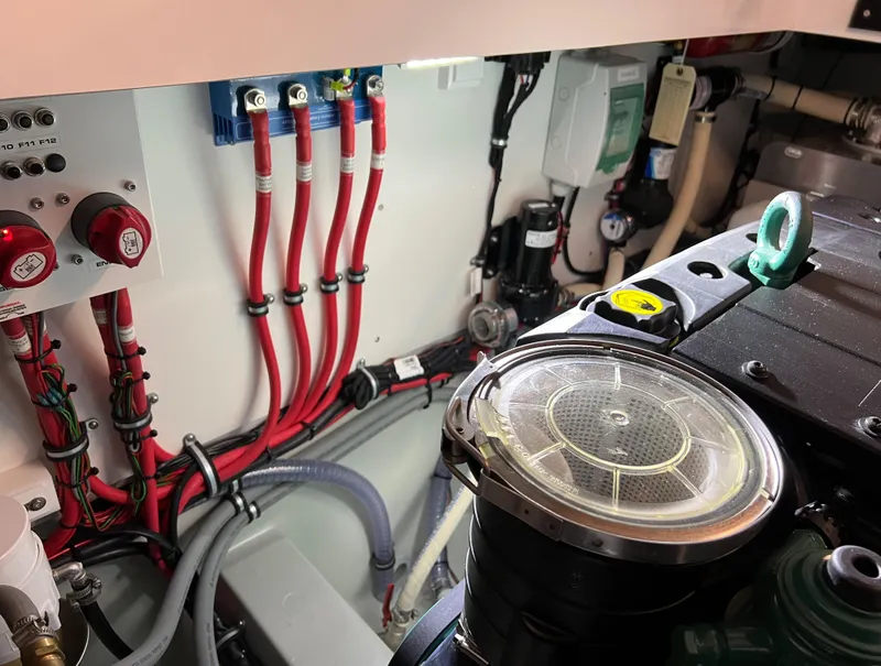 Slide: The Image of Engine compartment of a 2024 Sargo 28 boat with wiring and components. - 28