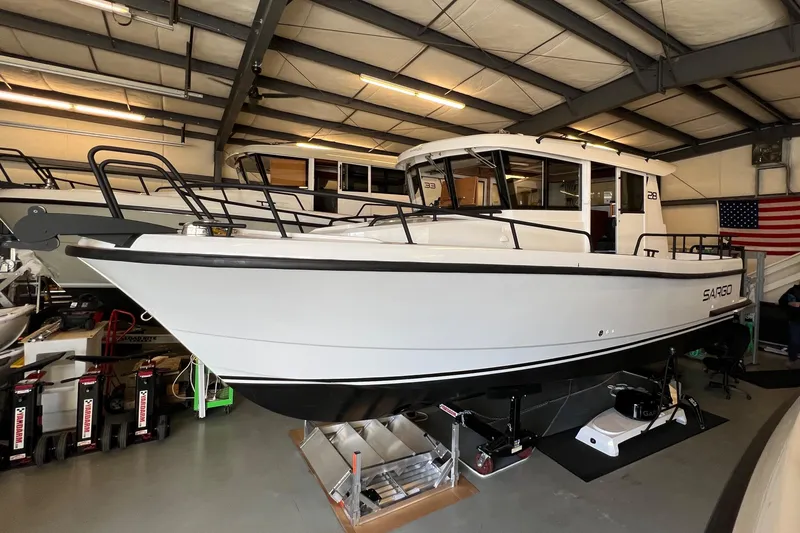 Slide: The Image of 2024 Sargo 28 boat in indoor storage facility. - 3