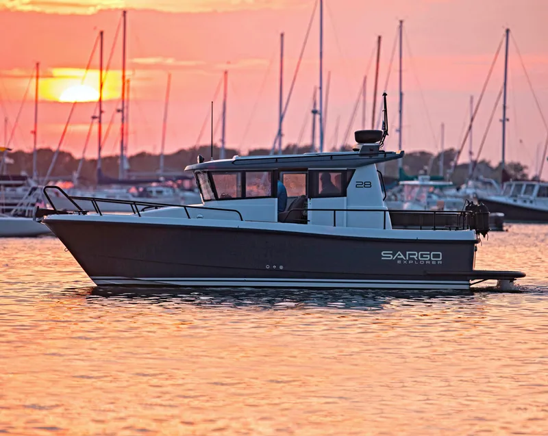Slide: The Image of 2024 Sargo 28 boat at sunset in a marina with sailboats. - 35