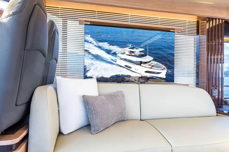 Slide: The Image of Luxurious interior of 2025 Absolute NAVETTA 52 yacht with modern seating and ocean view. - 14