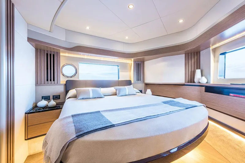 Slide: The Image of Luxurious bedroom interior of 2025 Absolute NAVETTA 52 yacht, featuring modern design and elegant decor. - 17