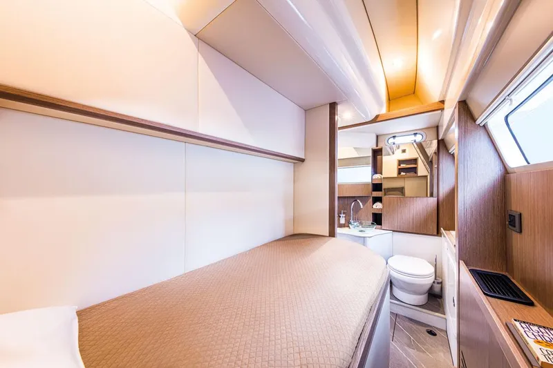 Slide: The Image of Luxurious interior of 2025 Absolute NAVETTA 52 yacht cabin with modern amenities. - 20