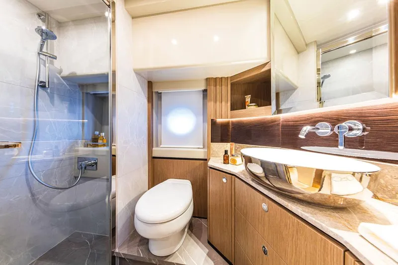 Slide: The Image of Luxurious bathroom in 2025 Absolute NAVETTA 52 yacht with modern fixtures and elegant design. - 22