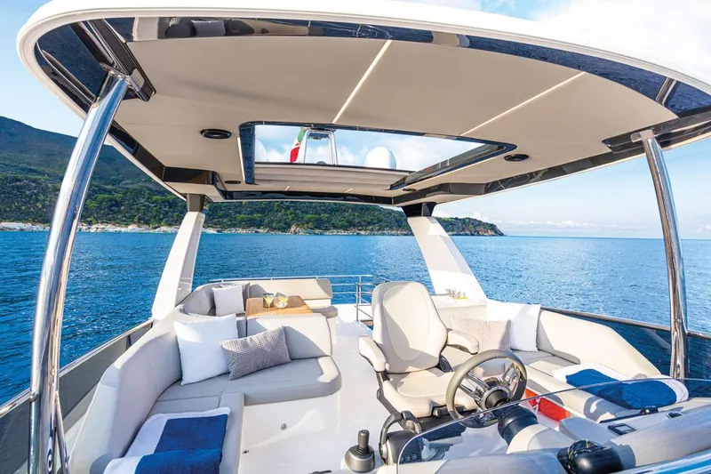 Slide: The Image of Luxurious 2025 Absolute NAVETTA 52 yacht interior with ocean view and elegant seating. - 5