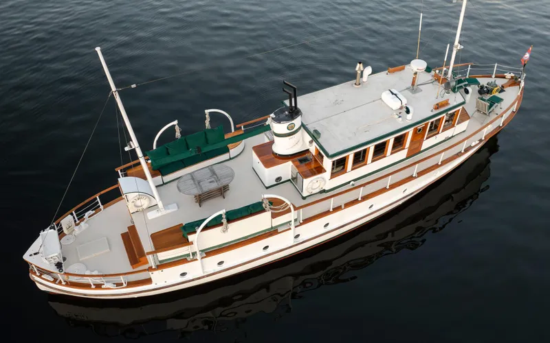 Slide: The Image of Aerial view of a 1931 Boeing Custom yacht on calm water. - 13