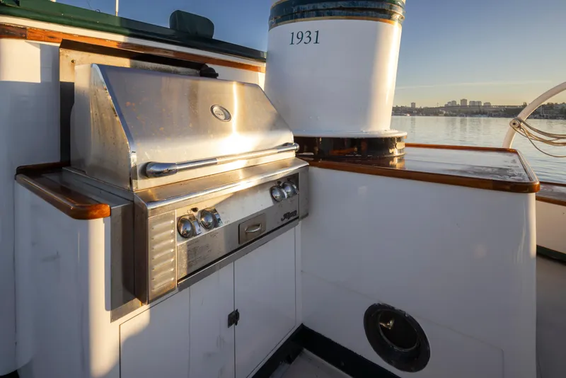 Slide: The Image of Outdoor grill on a 1931 Boeing Custom boat deck with scenic water view. - 26
