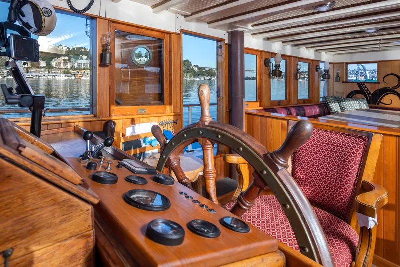 Slide: The Image of Vintage 1931 Boeing Custom ship interior with wooden helm and scenic window views. - 35