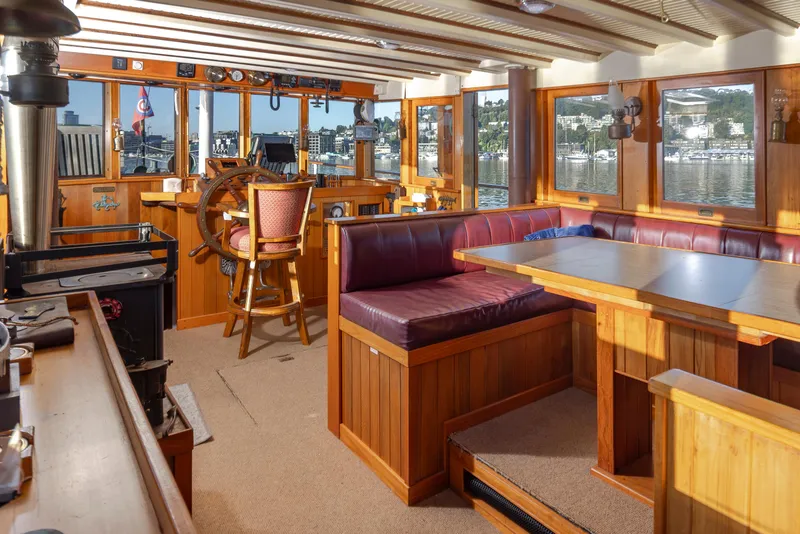 Slide: The Image of Interior of a 1931 Boeing Custom boat with wooden furnishings and a steering wheel. - 38