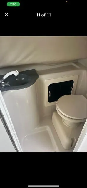 Slide: The Image of 1996 Pro-Line 2950 Mid Cabin bathroom with sink and toilet. - 4