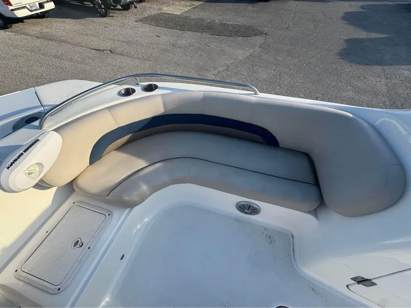 Slide: The Image of 2018 Hurricane SS 232 boat interior with curved seating and storage compartments. - 3