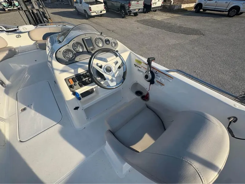 Slide: The Image of 2018 Hurricane SS 232 boat cockpit with steering wheel and control panel. - 4