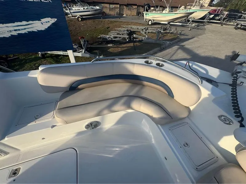 Slide: The Image of 2018 Hurricane SS 232 boat interior with cushioned seating and storage compartments. - 6