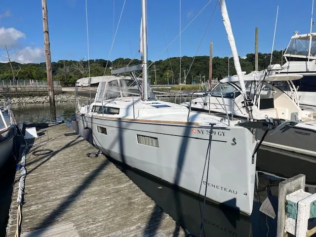 Slide: The Image of Beneteau Oceanis 38.1 sailboat docked, 2017 model, in a marina setting. - 2