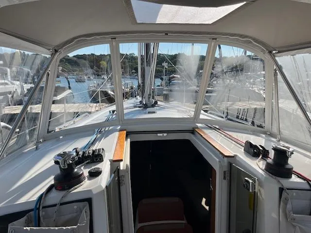 Slide: The Image of 2017 Beneteau Oceanis 38.1 sailboat cockpit view, docked at marina. - 21