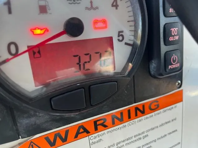 Slide: The Image of Close-up of Beneteau Oceanis 38.1 2017 engine gauge displaying 327 hours with warning label. - 25