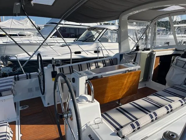 Slide: The Image of Cockpit of 2017 Beneteau Oceanis 38.1 sailboat with striped seating and dual steering wheels. - 3