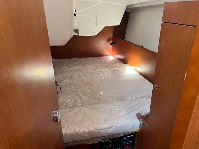Slide: The Image of Cabin interior of 2017 Beneteau Oceanis 38.1 sailboat with cozy bed setup. - 37