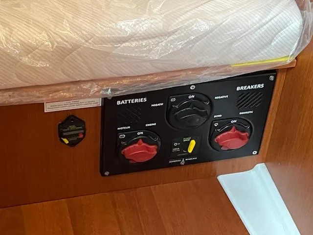 Slide: The Image of Control panel on a 2017 Beneteau Oceanis 38.1 yacht, featuring battery and breaker switches. - 38