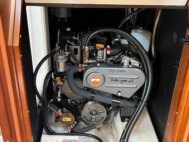 Slide: The Image of Engine compartment of a 2017 Beneteau Oceanis 38.1 sailboat, showcasing detailed mechanical components. - 41