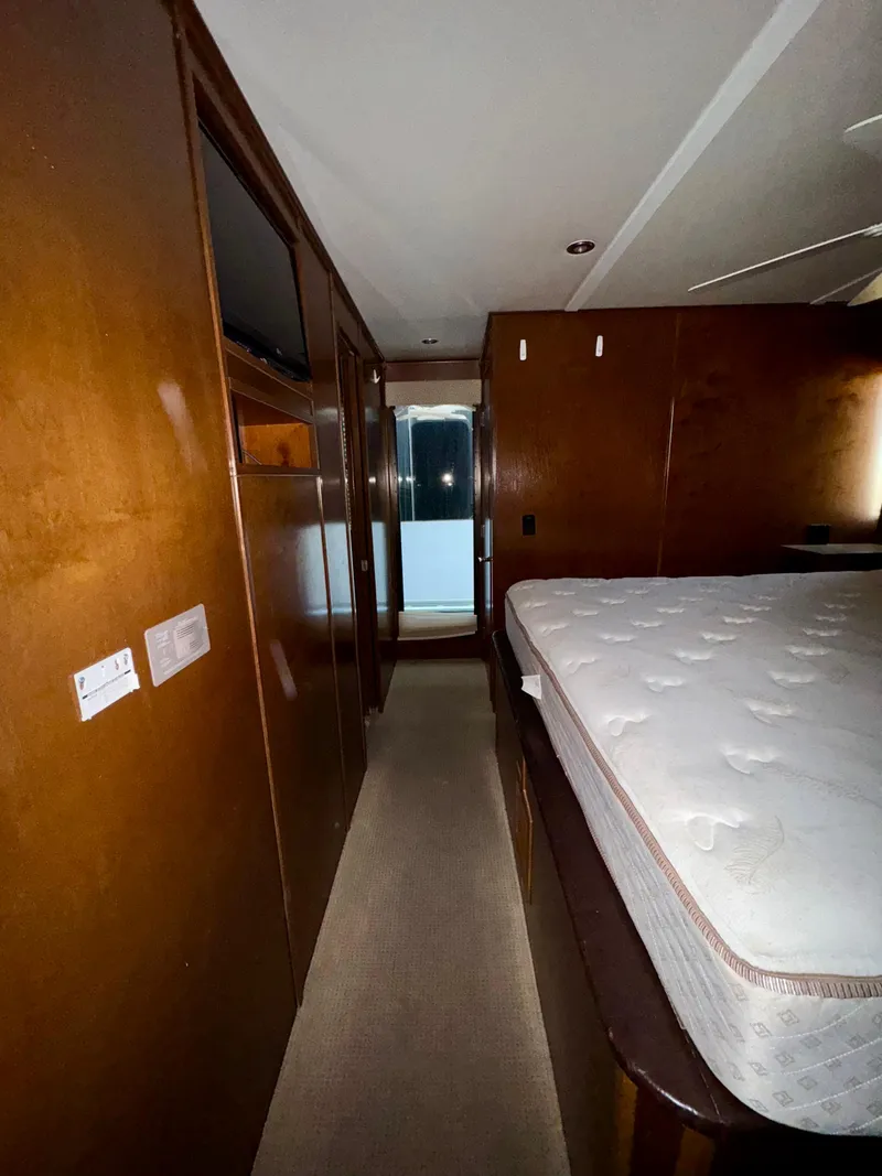 Slide: The Image of Interior of 2013 Bravada Bella Luna Trip #16, featuring a cozy bedroom with wooden finishes. - 19