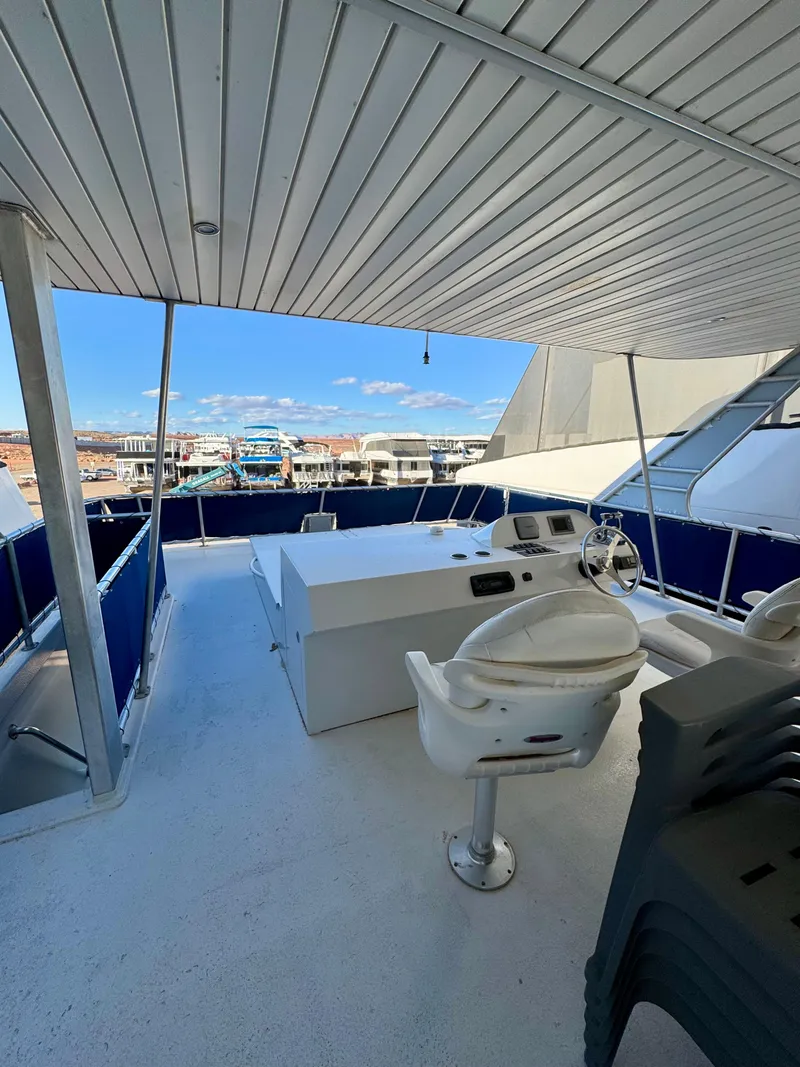 Slide: The Image of Upper deck of 2013 Bravada Bella Luna Trip #16 yacht with steering wheel and seating. - 25