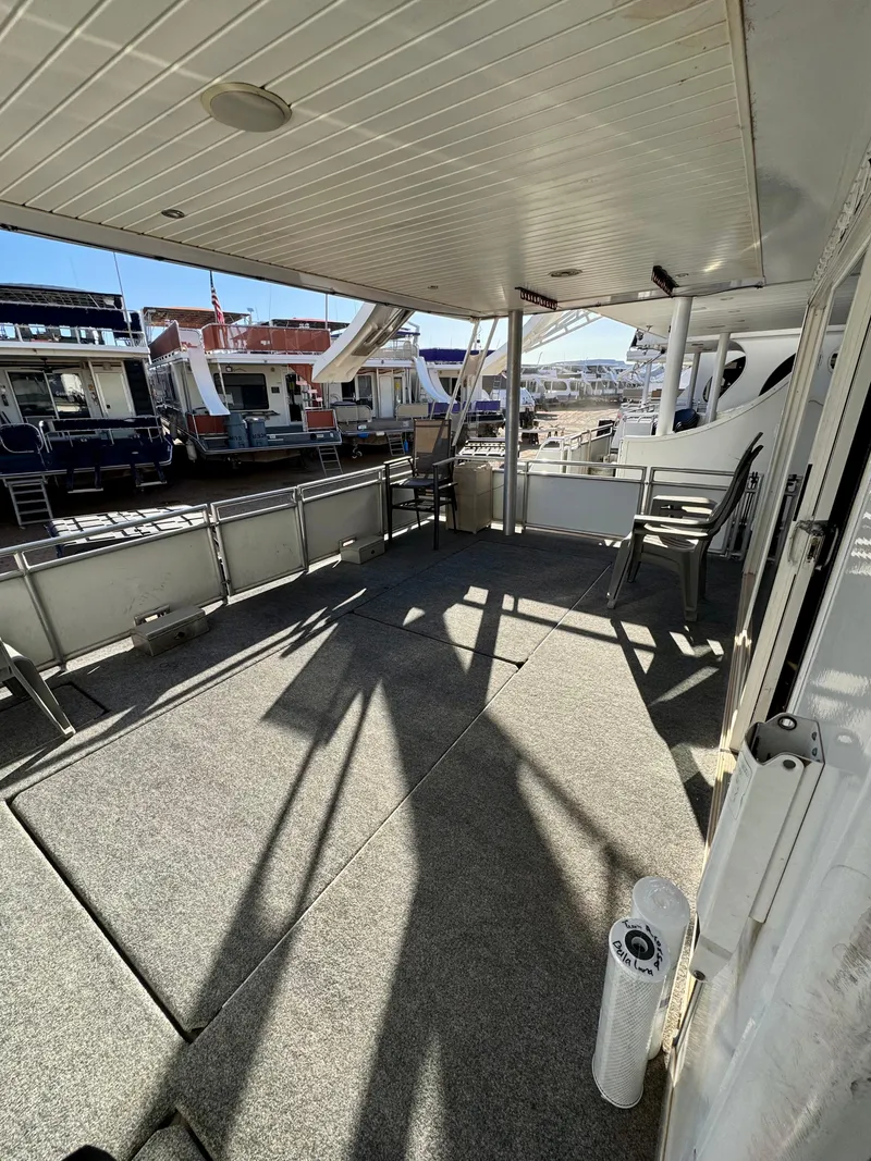 Slide: The Image of Spacious deck of 2013 Bravada Bella Luna Trip #16 houseboat at marina. - 4