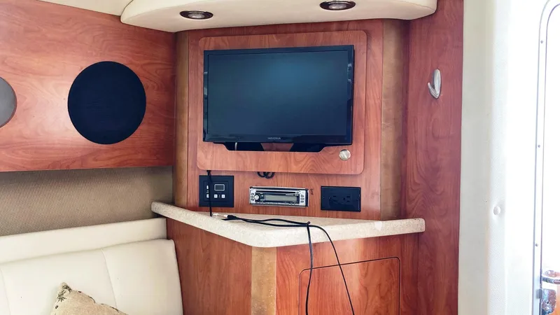 Slide: The Image of Interior of 2007 Rinker 280 Express Cruiser with TV and audio system. - 19