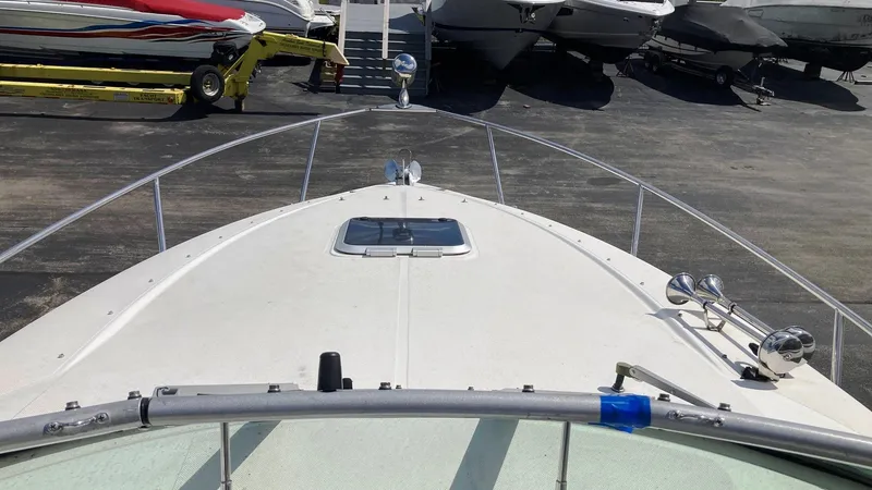 Slide: The Image of 2007 Rinker 280 Express Cruiser boat deck view in a marina. - 6