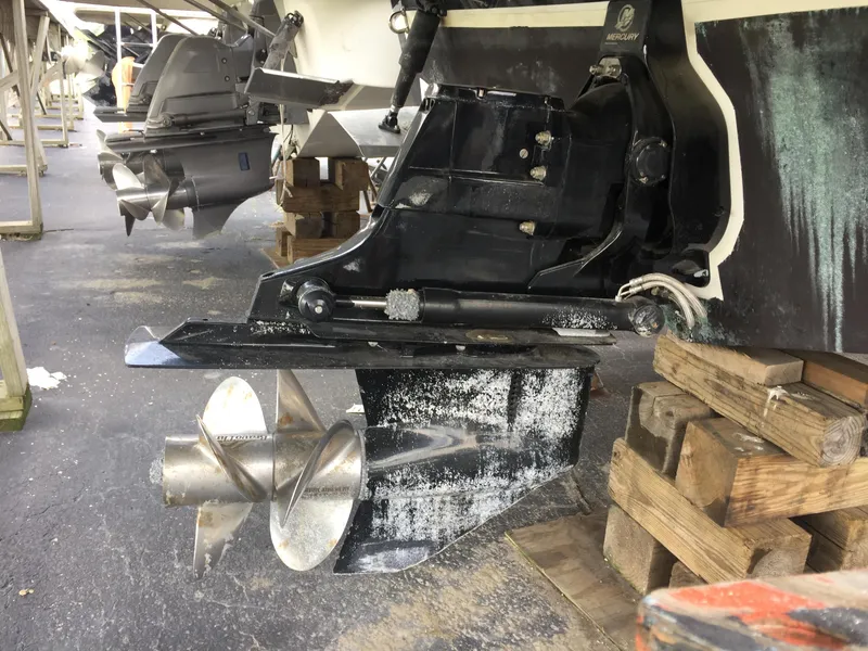 Slide: The Image of 2007 Rinker 280 Express Cruiser outdrive and propeller on dry dock. - 9