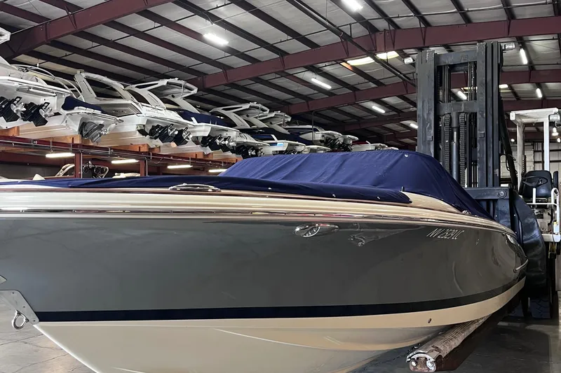 Slide: The Image of 2018 Chris-Craft 27 Launch boat in indoor storage facility. - 2