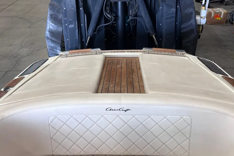 Slide: The Image of 2018 Chris-Craft 27 Launch boat interior with elegant wood and leather detailing. - 7