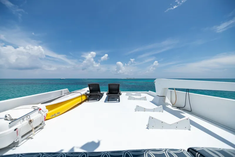 Slide: The Image of Top deck of a 1991 Broward Motor Yacht with ocean view. - 17