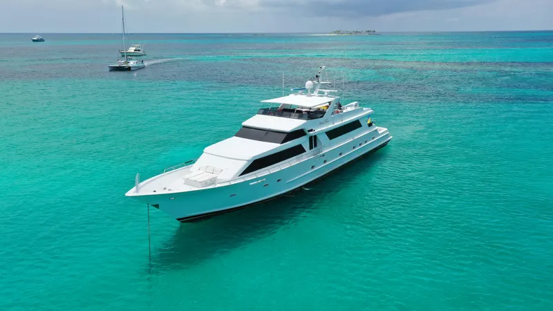Slide: The Image of Broward 1991 Motor Yacht anchored in clear turquoise waters. - 2