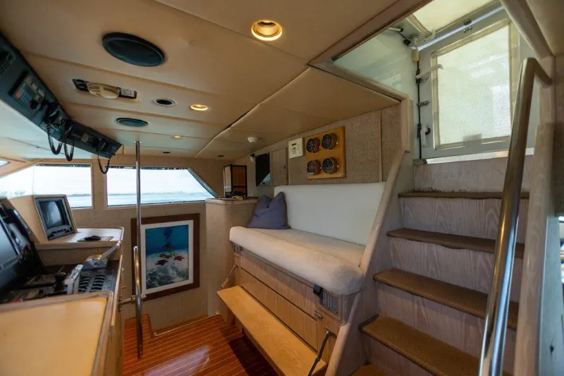 Slide: The Image of Interior of 1991 Broward Motor Yacht with navigation equipment and seating area. - 25