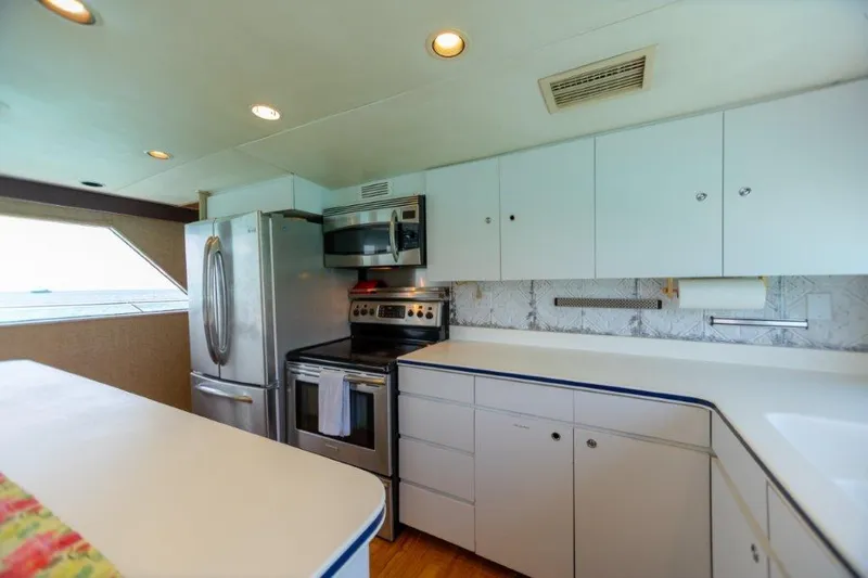 Slide: The Image of Modern kitchen in a 1991 Broward Motor Yacht with stainless steel appliances. - 36