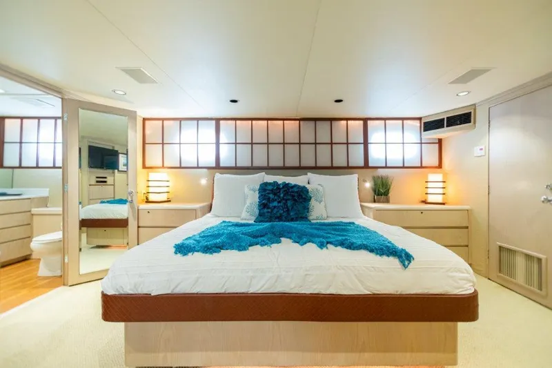 Slide: The Image of Luxurious bedroom in a 1991 Broward Motor Yacht with modern decor. - 44