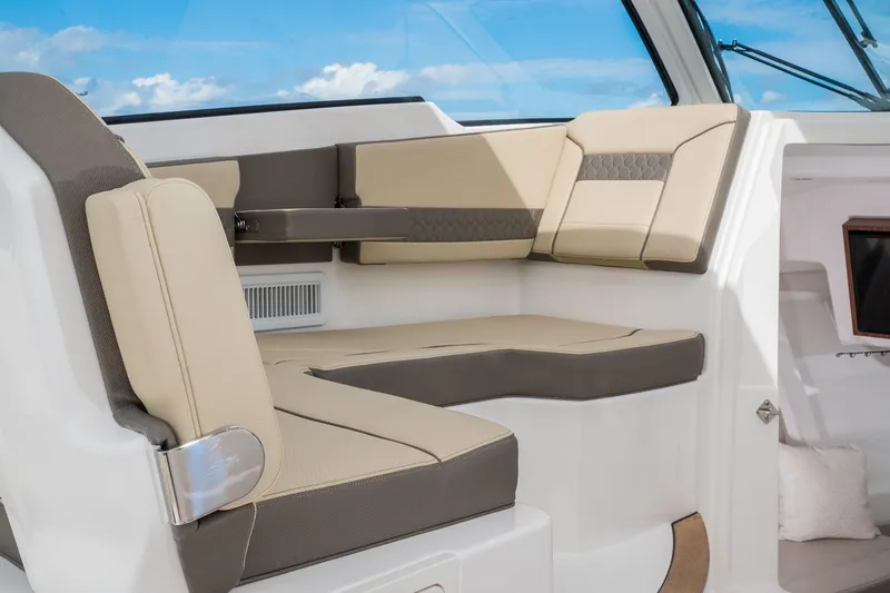 Slide: The Image of 2025 Pursuit DC 365 Dual Console boat interior seating area. - 10