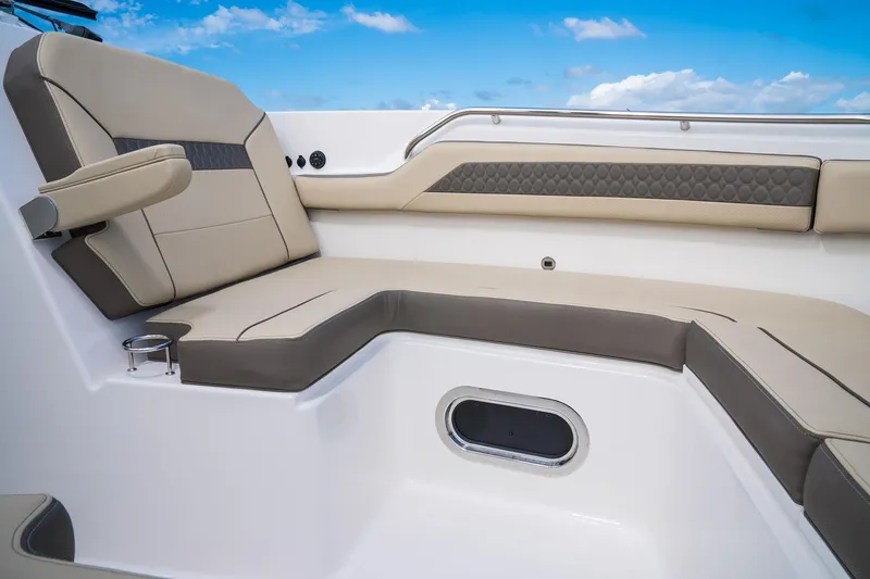 Slide: The Image of 2025 Pursuit DC 365 Dual Console boat interior with luxurious seating and cup holder. - 5