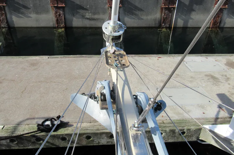 Slide: The Image of Bow of 1979 Worldcruiser schooner with anchor and rigging at dock. - 10