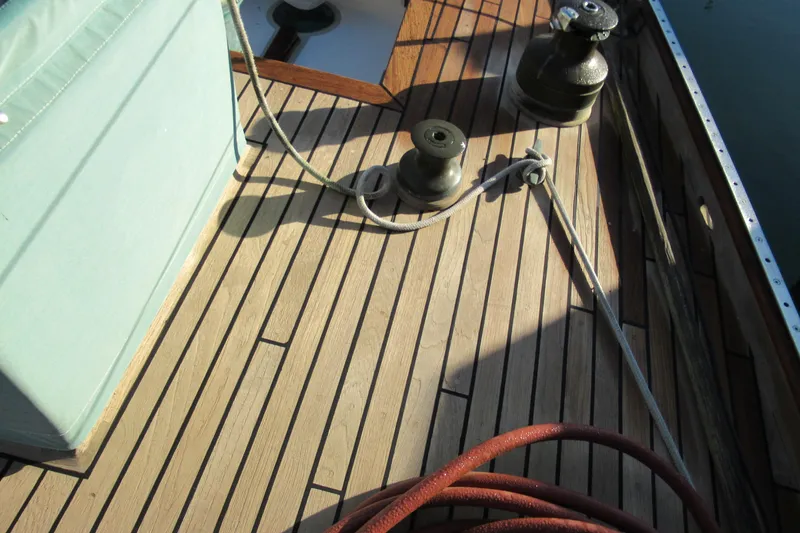 Slide: The Image of Deck of 1979 Worldcruiser schooner with winches and ropes in sunlight. - 4