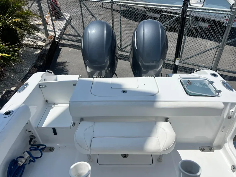 Slide: The Image of 2018 Sea Hunt Gamefish 25 boat with dual engines and seating area. - 15